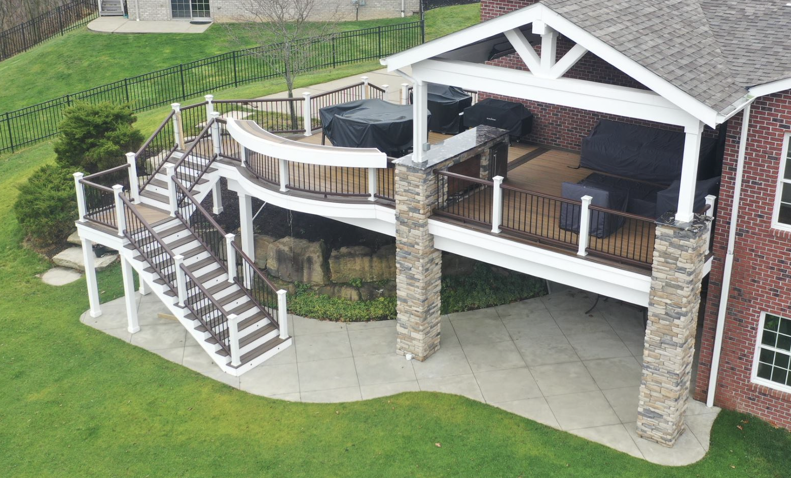 curved deck, backyard bar, under deck, composite deck, covered deck, covered porch
