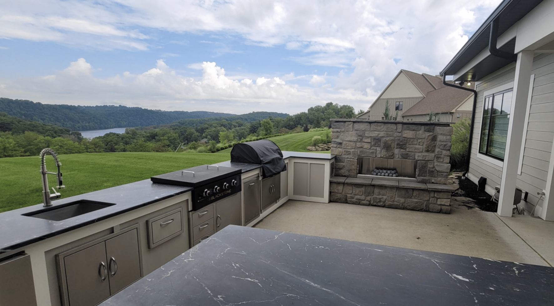 Outdoor Kitchen with Built in Grill, Sink and Fireplace