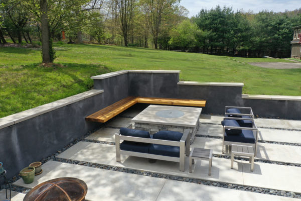 Fire pit with bench seating on patio