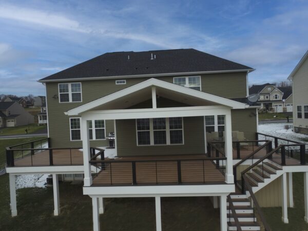 Raised covered composite deck with under deck storage