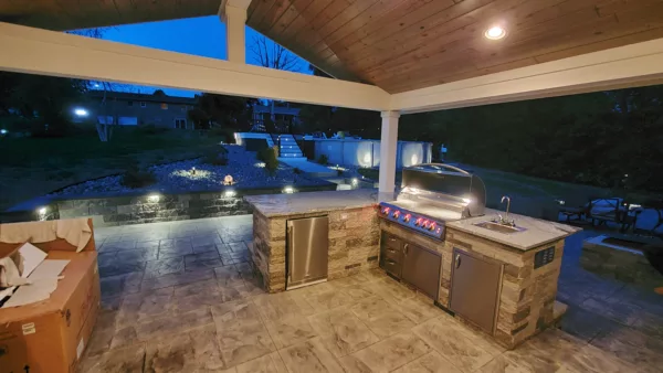 Covered outdoor kitchen lighting with built in grill