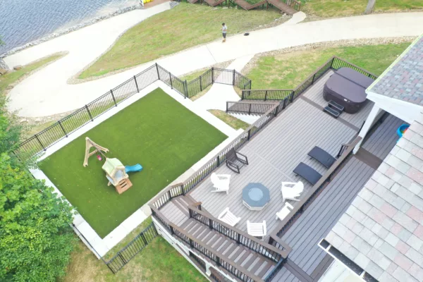 Two-tier deck with fenced in turf play area